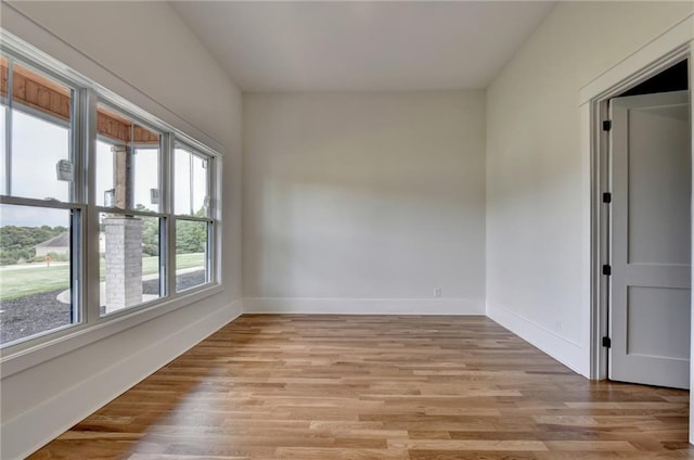 spare room with light hardwood / wood-style flooring