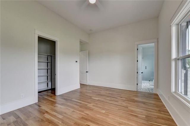 unfurnished bedroom featuring ceiling fan and light hardwood / wood-style flooring