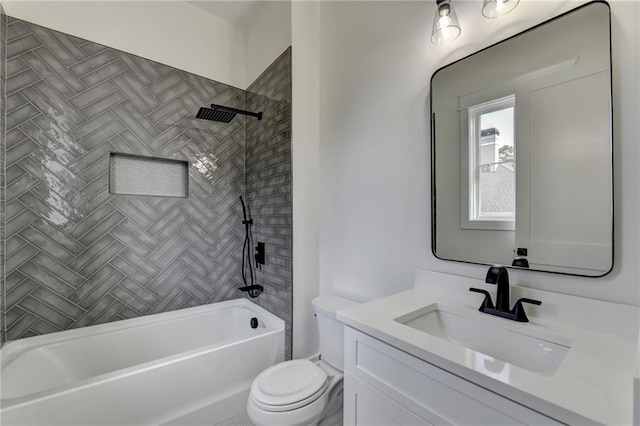 full bathroom with vanity, tiled shower / bath combo, and toilet