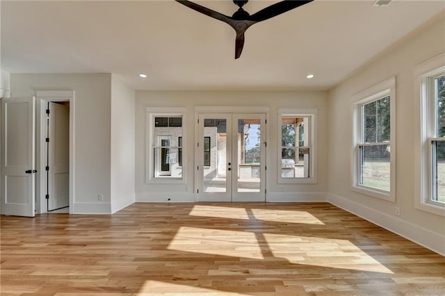 interior space featuring french doors, ceiling fan, and light hardwood / wood-style floors