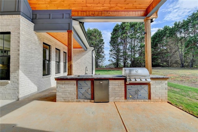 view of patio / terrace with sink, grilling area, and exterior kitchen