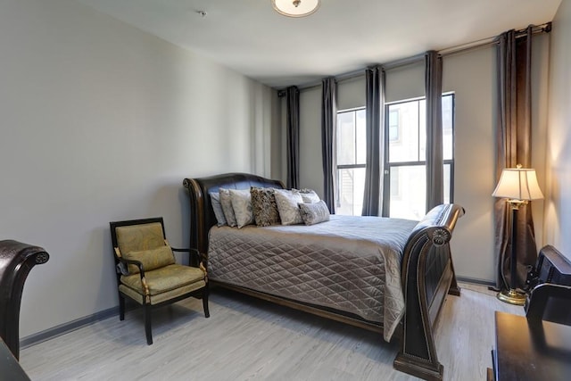 bedroom with light wood-type flooring