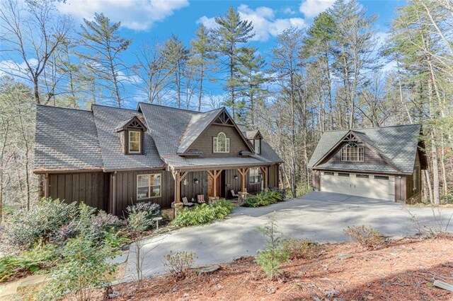 view of front of home with a porch and a garage