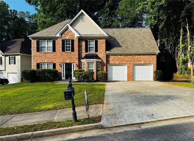 108 Northcutt Station Pl, Acworth, GA 30101 - view of front of house featuring an attached garage, a front lawn, brick siding, and driveway