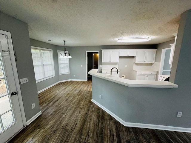 108 Northcutt Station Pl, Acworth, GA 30101 - kitchen with a chandelier, baseboards, dark wood-style floors, a textured ceiling, and white cabinetry