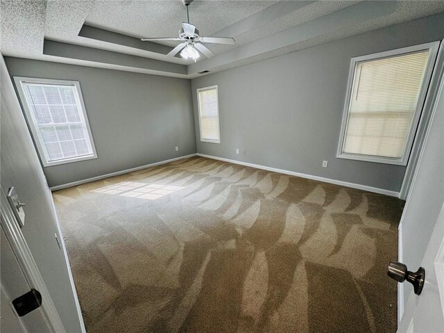 108 Northcutt Station Pl, Acworth, GA 30101 - unfurnished room featuring carpet flooring, a raised ceiling, a textured ceiling, baseboards, and a ceiling fan