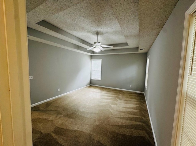 108 Northcutt Station Pl, Acworth, GA 30101 - carpeted spare room with a tray ceiling, a textured ceiling, a ceiling fan, and baseboards