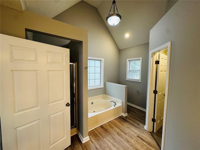 108 Northcutt Station Pl, Acworth, GA 30101 - full bath featuring wood finished floors, a tub with jets, a shower stall, baseboards, and high vaulted ceiling