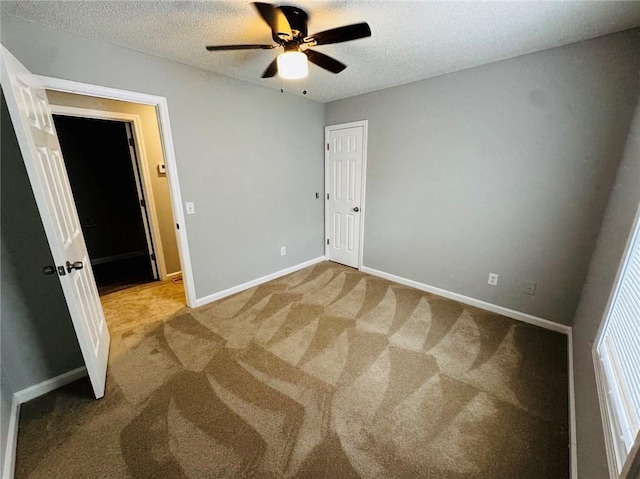108 Northcutt Station Pl, Acworth, GA 30101 - unfurnished bedroom featuring a textured ceiling, baseboards, carpet flooring, and ceiling fan
