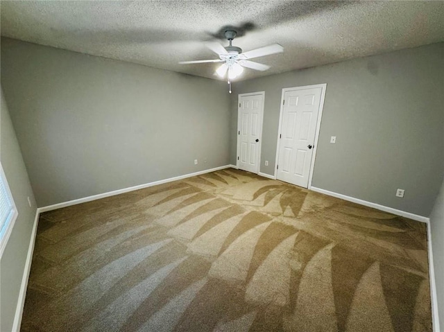 108 Northcutt Station Pl, Acworth, GA 30101 - unfurnished bedroom featuring carpet floors, baseboards, a ceiling fan, and a textured ceiling
