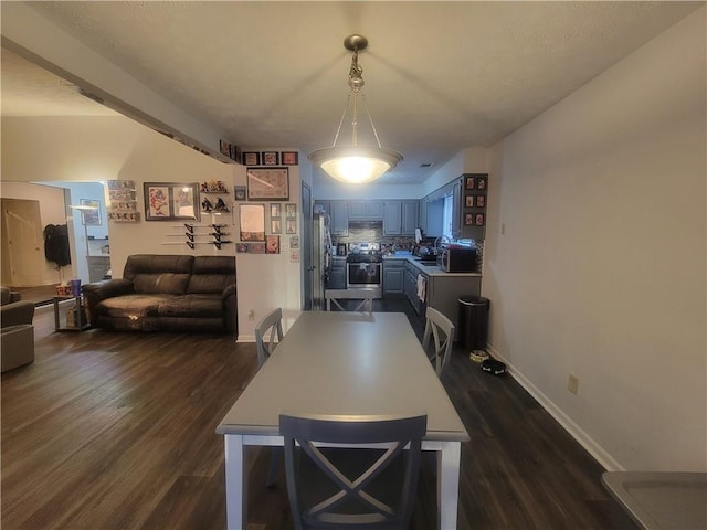 dining area featuring dark hardwood / wood-style flooring