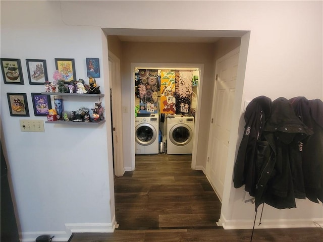 clothes washing area with dark wood-type flooring and washing machine and clothes dryer