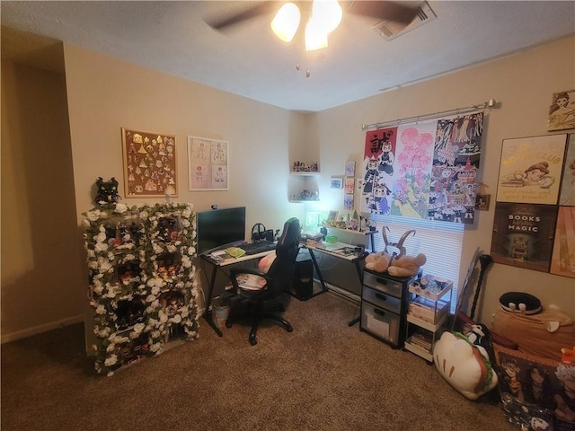 carpeted office with visible vents and ceiling fan