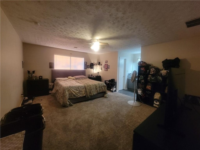 bedroom featuring visible vents, carpet, a ceiling fan, and a textured ceiling