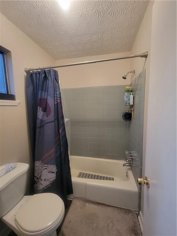 bathroom with tiled shower / bath and sink