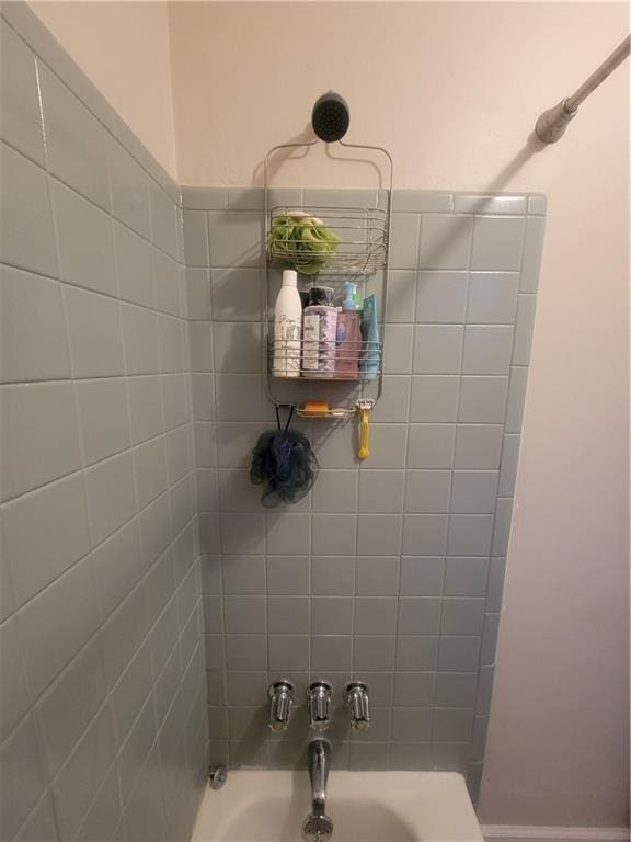 bathroom with a sink and shower / bath combination