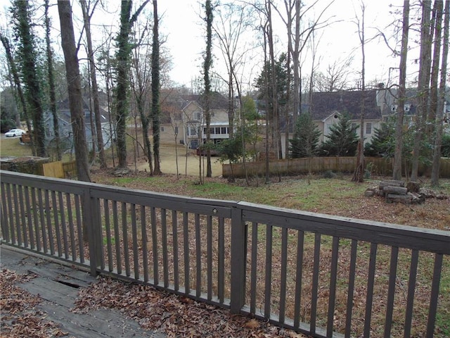 exterior space with a residential view and fence