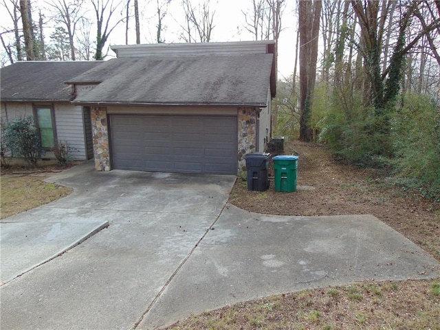 garage featuring driveway