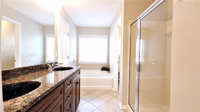 bathroom featuring a sink, tile patterned flooring, a stall shower, and a bath