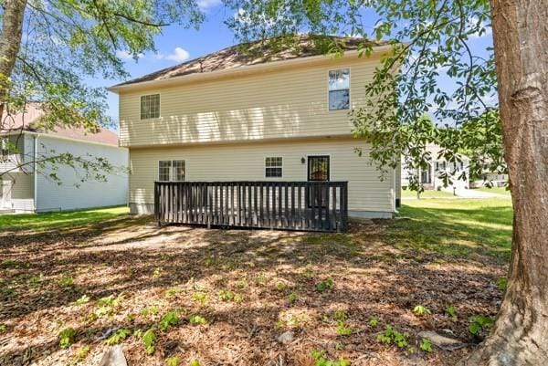 back of house with a wooden deck