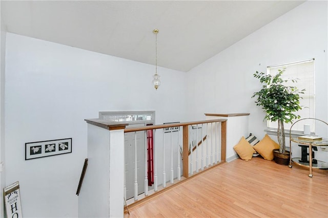 staircase with hardwood / wood-style flooring