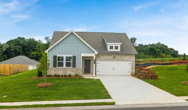 203 Overton Dr, Perry, GA 31069 - craftsman-style house with board and batten siding, brick siding, concrete driveway, an attached garage, and roof with shingles