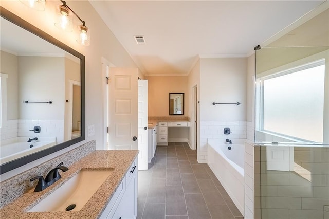 bathroom with a garden tub, crown molding, vanity, and tile patterned floors