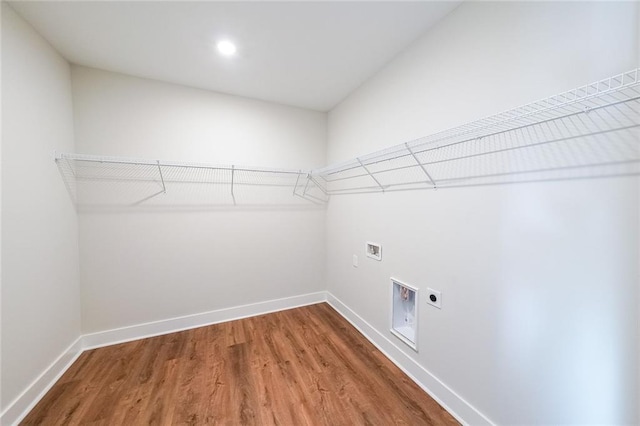 washroom featuring baseboards, laundry area, hookup for a washing machine, and hookup for an electric dryer