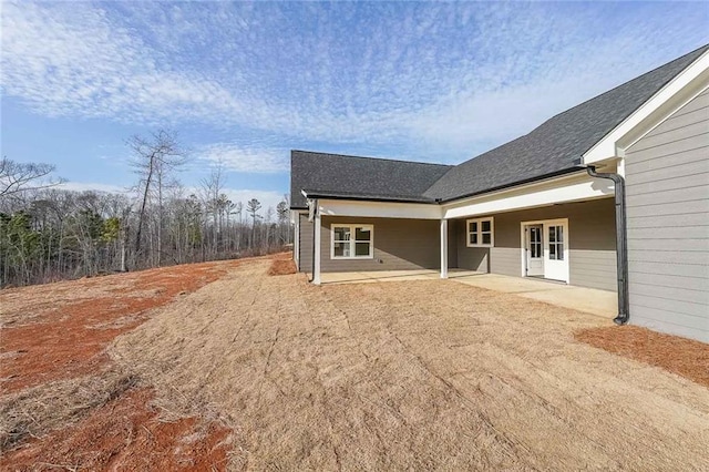 rear view of property featuring a patio