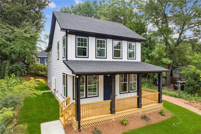 view of front of house featuring a front lawn and a porch