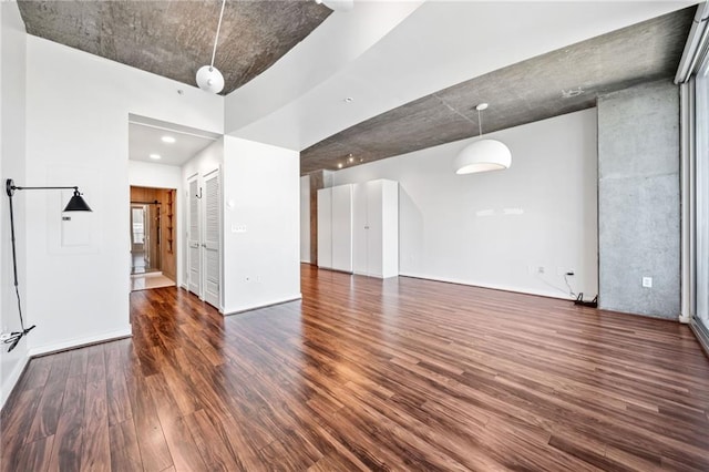 interior space with dark hardwood / wood-style flooring