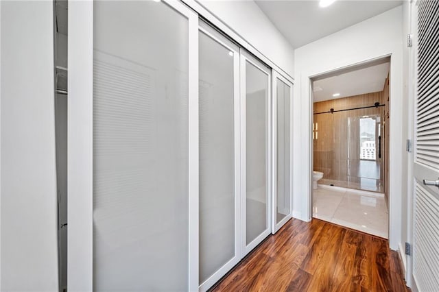 hall with dark hardwood / wood-style flooring