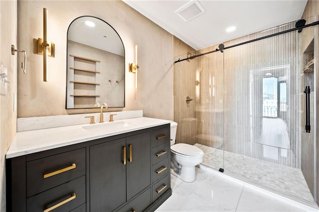 bathroom featuring vanity, walk in shower, and toilet