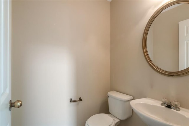 3984 Oak Glenn Dr, Duluth, GA 30096 - half bathroom featuring toilet and a sink
