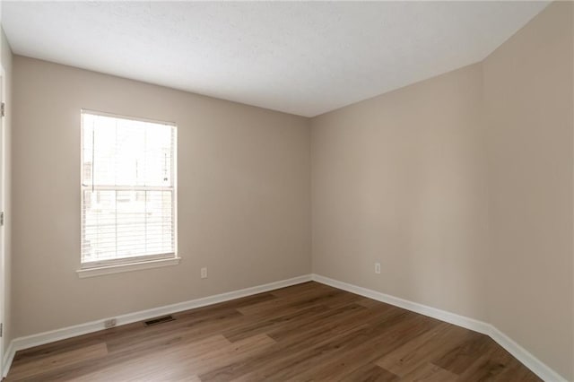3984 Oak Glenn Dr, Duluth, GA 30096 - empty room featuring wood finished floors, plenty of natural light, and baseboards