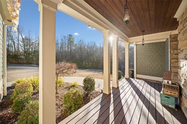 wooden terrace featuring covered porch