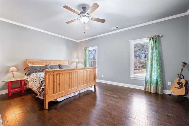 bedroom with dark hardwood / wood-style flooring, ceiling fan, and crown molding