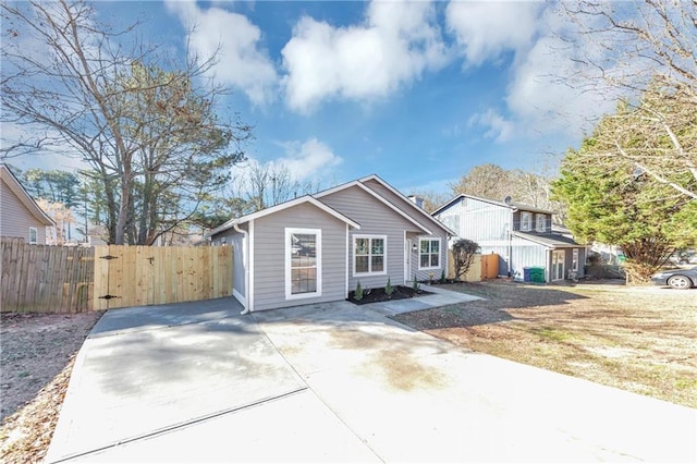 bungalow with a gate and fence