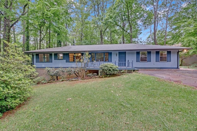 4856 Rock Haven Dr, Lilburn, GA 30047 - single story home featuring a porch, a front yard, and driveway
