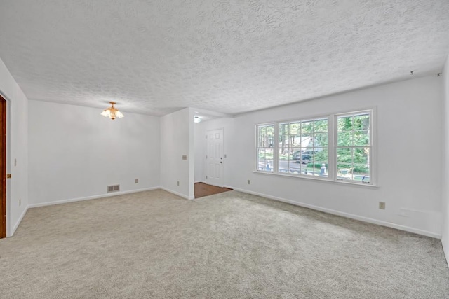 4856 Rock Haven Dr, Lilburn, GA 30047 - carpeted empty room featuring baseboards and a textured ceiling