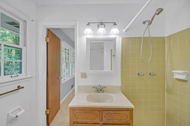 4856 Rock Haven Dr, Lilburn, GA 30047 - bathroom featuring tiled shower, plenty of natural light, and vanity