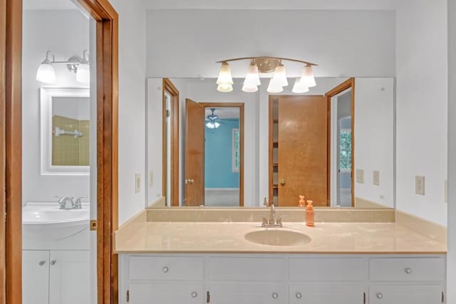 4856 Rock Haven Dr, Lilburn, GA 30047 - bathroom with two vanities and a ceiling fan
