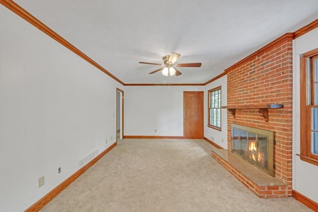 4856 Rock Haven Dr, Lilburn, GA 30047 - unfurnished living room featuring baseboards, ceiling fan, a fireplace, crown molding, and carpet flooring