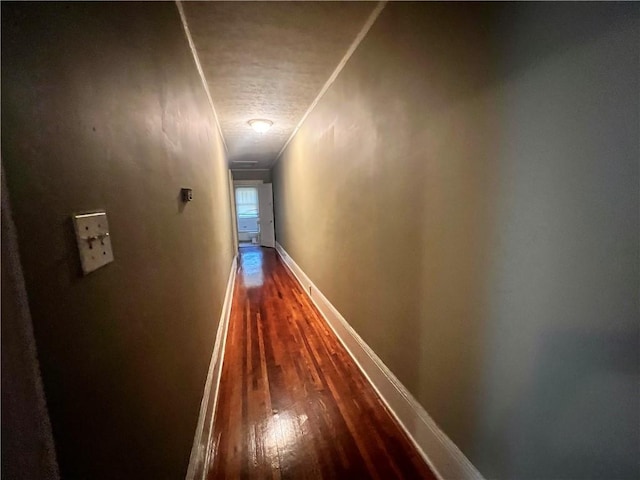 1165 Oak St SW, Atlanta, GA 30310 - hallway with dark wood-style floors, a textured ceiling, baseboards, and ornamental molding