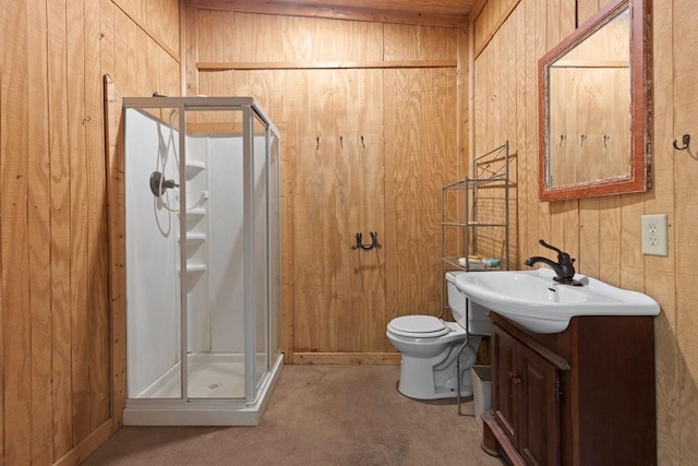 bathroom featuring vanity, wood walls, toilet, and walk in shower