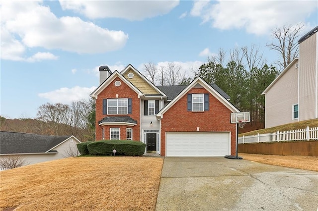 traditional home featuring an attached garage, brick siding, fence, driveway, and a chimney