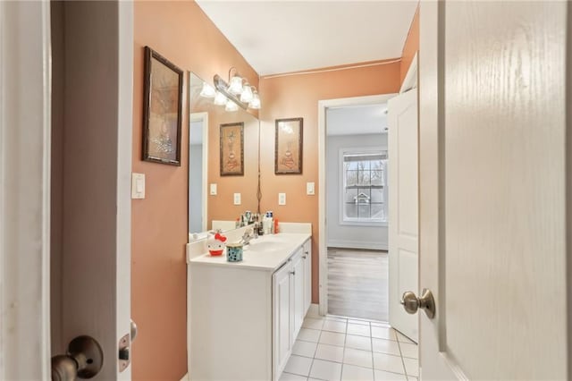 bathroom featuring baseboards, vanity, and tile patterned floors