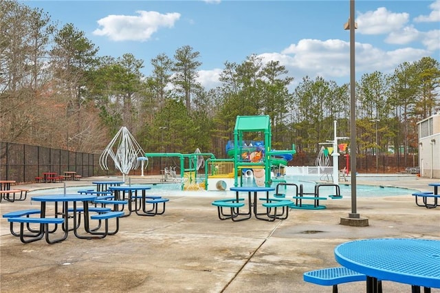 communal playground featuring fence