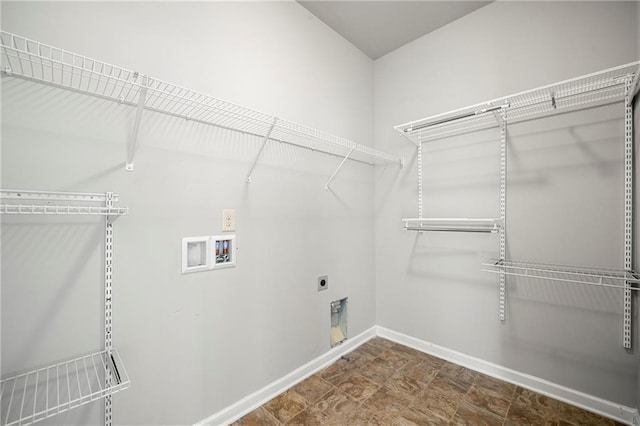 clothes washing area with washer hookup and hookup for an electric dryer