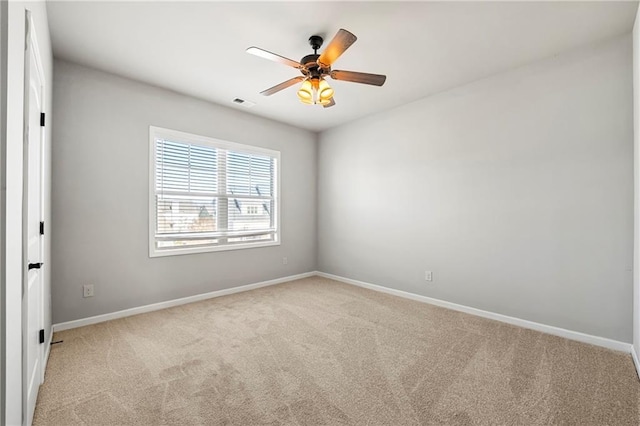 unfurnished room with light carpet and ceiling fan